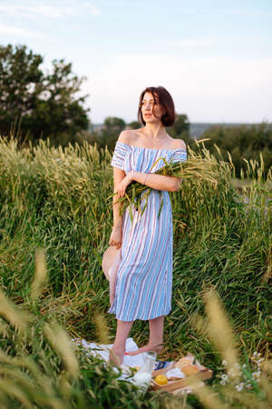 Beautiful young woman in summer in a wheat field 1の写真素材