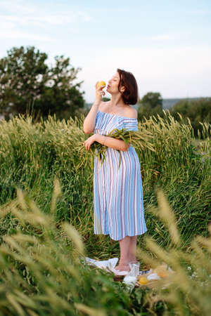 Beautiful young woman in summer in a wheat field 1の写真素材