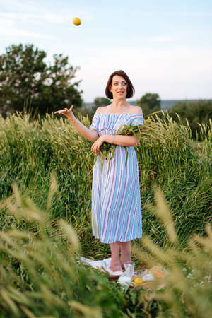 Beautiful young woman in summer in a wheat field 1の写真素材
