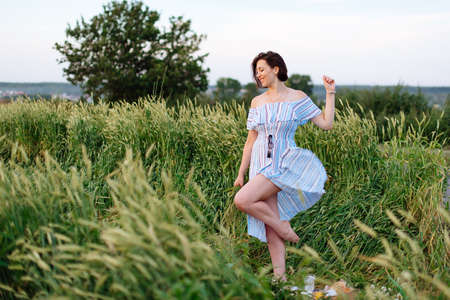 Beautiful young woman in summer in a wheat field 1の写真素材