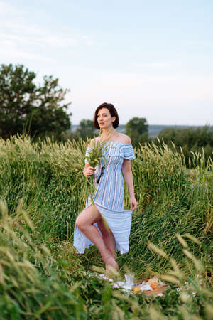 Beautiful young woman in summer in a wheat field 1の写真素材