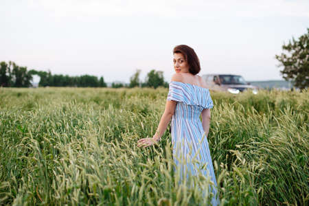 Beautiful young woman in summer in a wheat field 1の写真素材