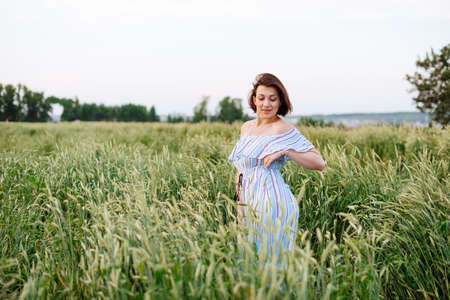 Beautiful young woman in summer in a wheat field 1の写真素材