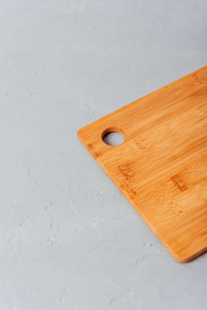 part of a cutting wooden board on a blue background with flour 1の写真素材