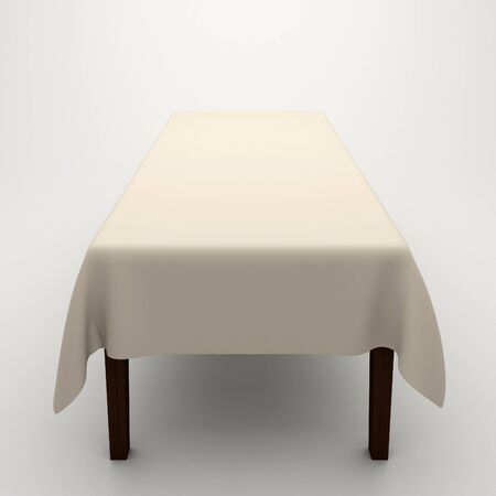 Table covered with a cloth on a white backgroundの写真素材