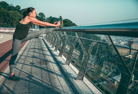Tying shoelaces before running outdoors stock photoの写真素材