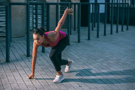 Concentrated professional sportswoman at the crouch start stock photoの写真素材