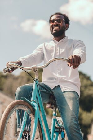 New bike of happy young man stock photoの写真素材