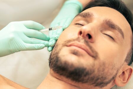 Close up of the vitamin injection into the facial skinの写真素材