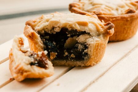 Homemade mince pie with blueberry jam filling on the boardの写真素材