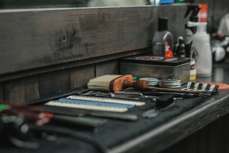 Close up of brushes and comps on barber counterの写真素材