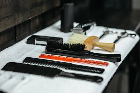 Various brushes lying on the white towel
