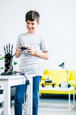 Positive smart boy testing his engineering creationの写真素材