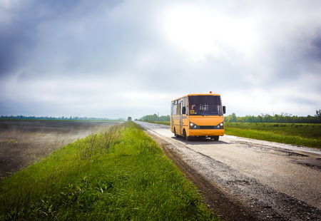 yellow school bus on the fog road