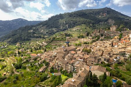 Valldemossa, Mallorca, Spain Sunny day. Beautiful European village in a valley in the mountains, sand colored houses, amazing view, authentic buildingの写真素材