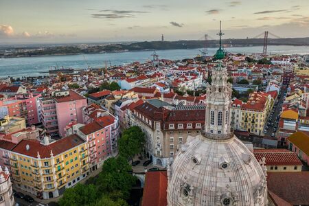 dome of the church and rooftops of Lisbon Lapa basilica, aerial viewの写真素材