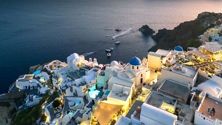 Santorini panorama greece in evening, european seaside resort, white housesの写真素材