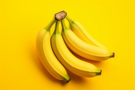 Bunch of bananas on yellow background. Top view. Flat layの素材