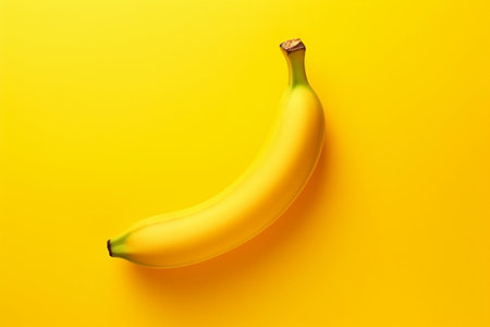 Banana on yellow background. Minimal style. Top view.の素材
