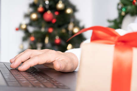 senior female doing shopping for Christmas at home. old age concept.