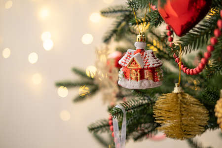 Christmas bauble on Christmas tree with lights bokeh backgroundの写真素材