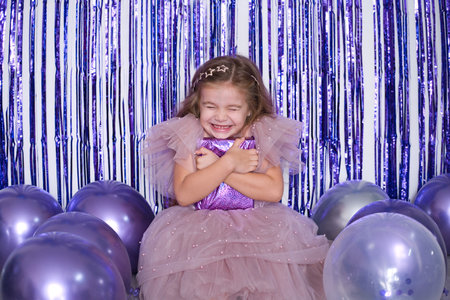 cute girl with gift box celebrating her birthdayの写真素材