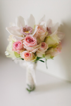 wedding bouquet  with orchids and roses on white background in fine art syleの写真素材