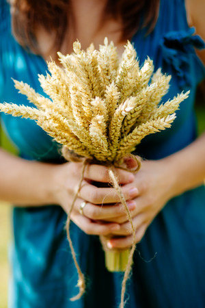 bouquet with spikelets of wheat close up in motherの写真素材