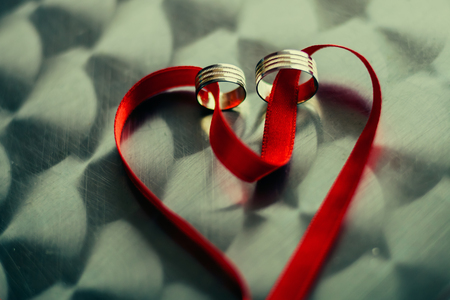 heart shape red band with engagement ringsの写真素材