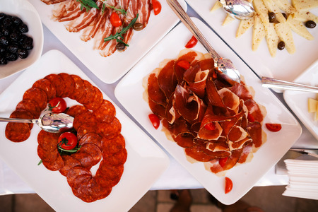 Buffet appetizers gourmet salami and prosciutto top view