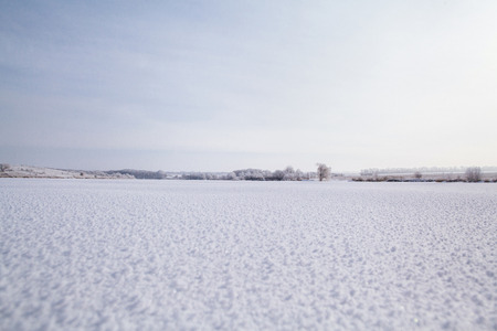 frozen picturesque lake with winter snowの写真素材