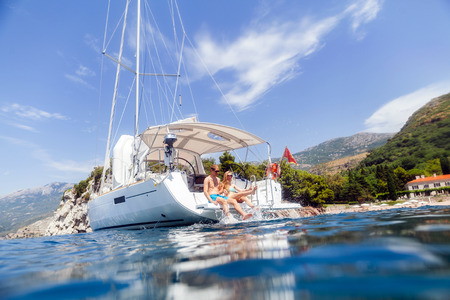 couple yacht honeymoon sailing luxury cruise. View from the waterの写真素材