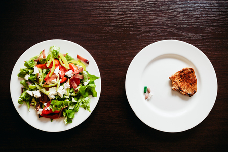 salad with pills and meat top viewの写真素材