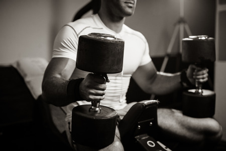 bodybuilder guy pumping hands close up monochromeの写真素材