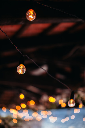 light bulb filament at party with bokeh background