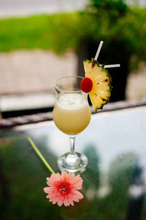 pineapple exotic cocktail in tropic barの写真素材