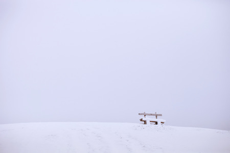 snow mountain with wooden bench. Winter landscapeの写真素材