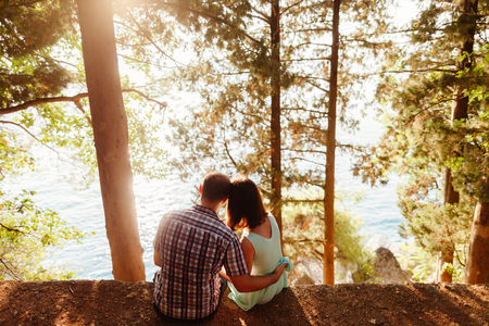 lovely couple travel together in park with sunlightの写真素材