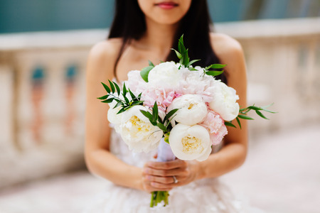 wedding bouquet orchids and peonies. Fine art wedding bouquet and flowers backgroundの写真素材