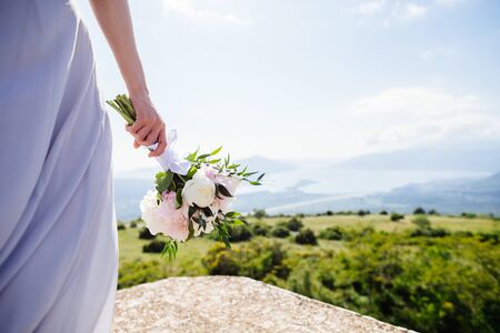 wedding bouquet orchids and peonies. Fine art wedding bouquet and flowers backgroundの写真素材