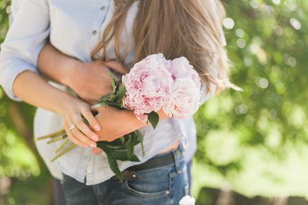 engaged couple hug together. Close up shot of handsの写真素材