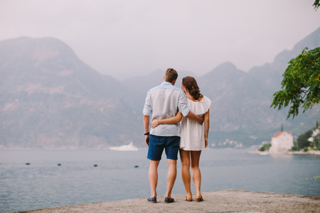 honeymoon couple travel sea and beach resort in Europe. Back view. Sea and beach side in Montenegroの写真素材
