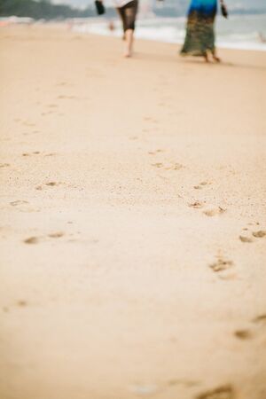 couple relax on beach together. Sea view and sandy beach in Asia, Vietnamの写真素材