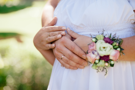 engaged couple hug together. Close up shot of handsの写真素材