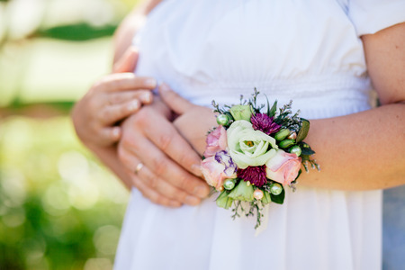 engaged couple hug together. Close up shot of handsの写真素材