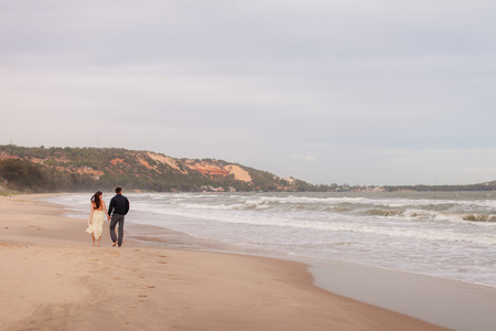 couple relax on beach together. Sea view and sandy beach in Asia, Vietnamの写真素材
