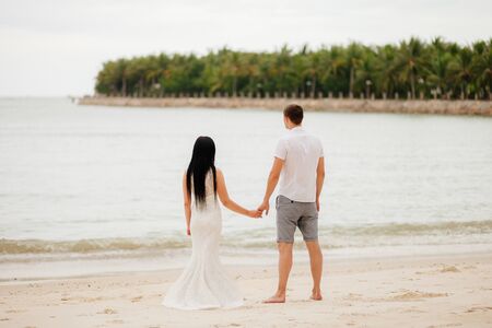 honeymoon couple relax on beach. Sea view and sandy beach in Asia, Vietnamの写真素材