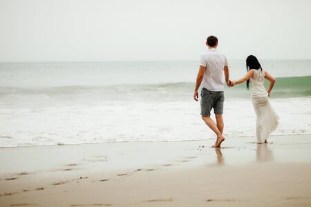 honeymoon couple relax on beach. Sea view and sandy beach in Asia, Vietnamの写真素材