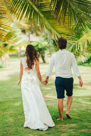 honeymoon couple relax on beach. Sea view and palms in Asia, Vietnamの写真素材
