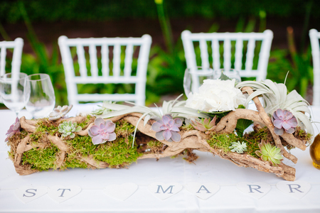 wedding table coverage with flowers decoration. Wedding venue ceremony.の写真素材